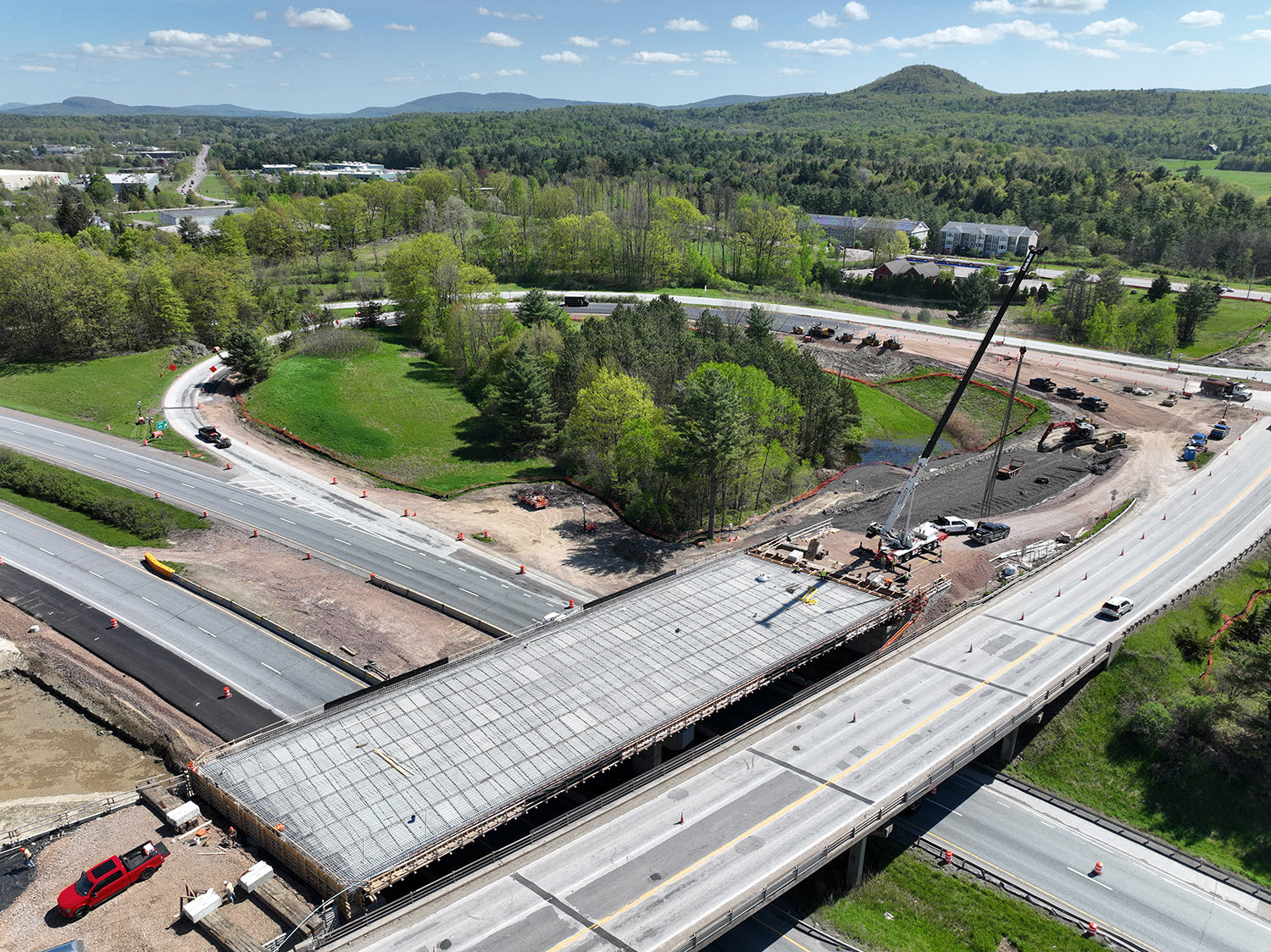 Crews continue constructing a new bridge over I-89 at Exit 17 and new northbound on and off ramps in Colchester, VT.