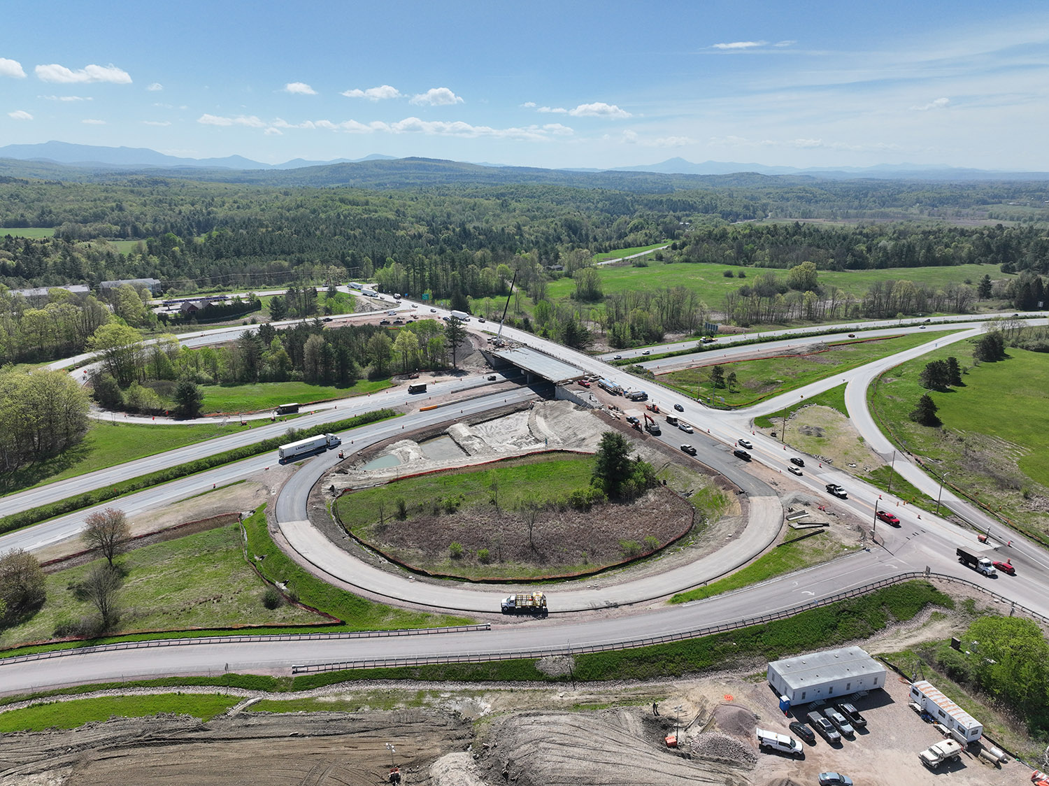 Crews continue constructing the gravel wetland near the new I-89 Exit 17 southbound on-ramp in Colchester, VT.