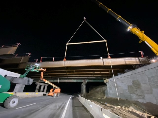 Crews install structural steel girders for the new U.S. 2 bridge over I-89 in Colchester, VT. 