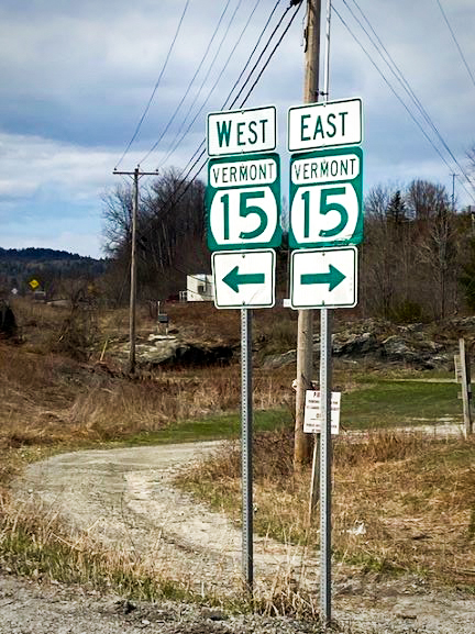 Signs of the junction of VT Routes 15 East and West