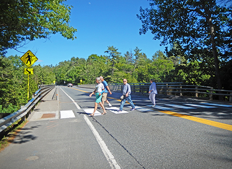 Pedestrians Cross the Way at the Quechee Bridge