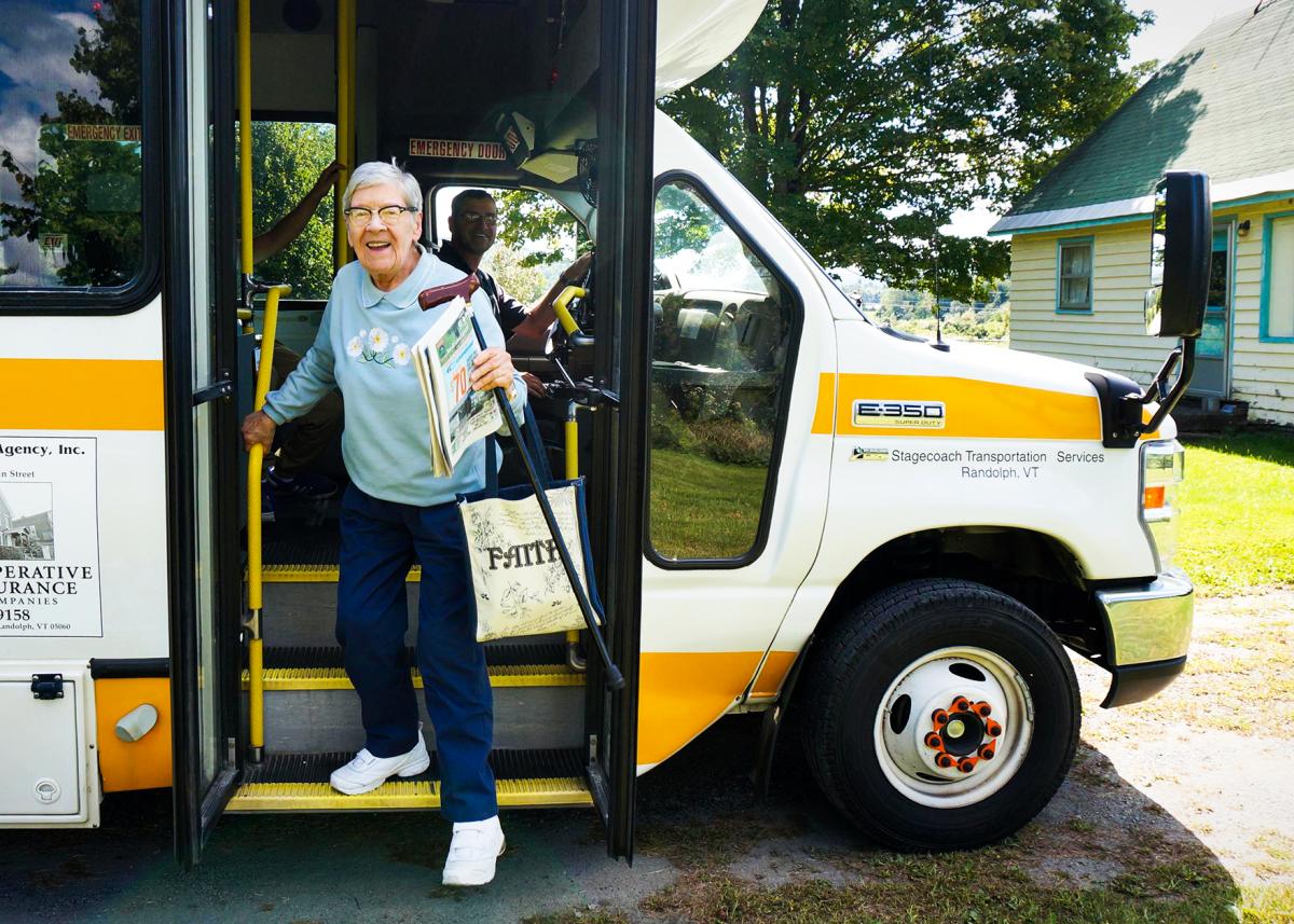 A passenger walks off a Public Transit bus