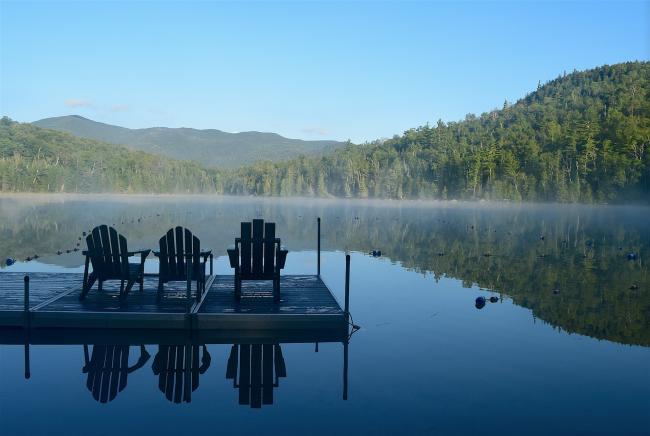 Adirondack chairs on lake